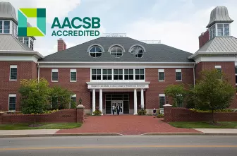 exterior photo of COBE with AACSB logo overlay