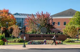 Student walking across campus