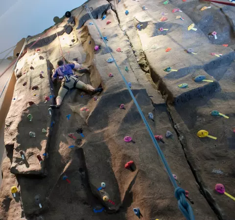 student climbing