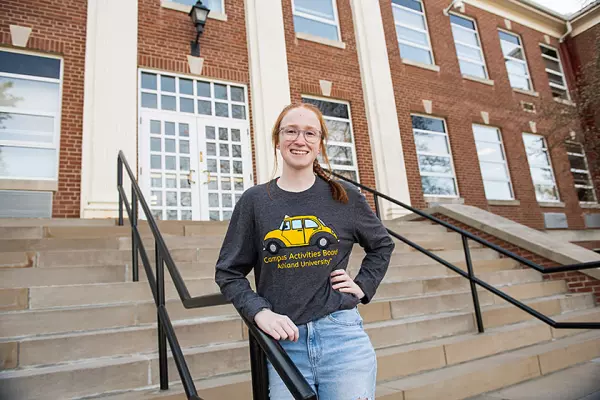 Maeve Kelly in front of Founders Hall