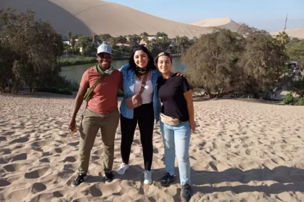 Carolina Amparo (right) with friends at the Ica Desert in Peru. 