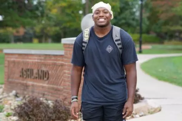 Nehemiah Cannon walking on campus