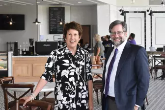 Jody Ruhl and President Jon Peede pose for a photo in the Lyceum Cafe