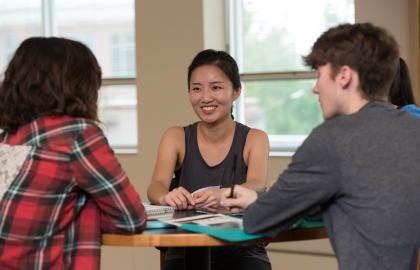 International students sitting around a table