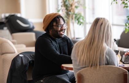 Students relaxing in the College of Nursing lounge area