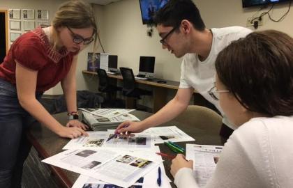 Collegian editors looking over proofs for the next issue