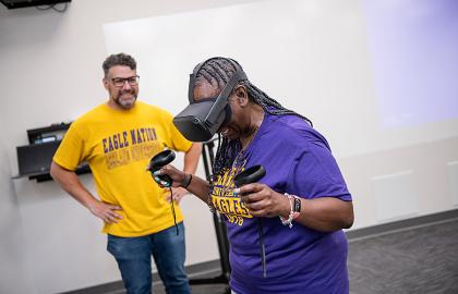 a teacher trying VR at the Telecommunications Bootcamp for Educators