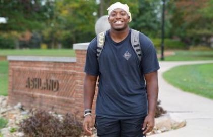 Nehemiah Cannon walking on campus