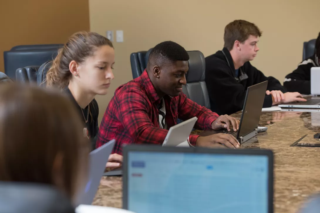 Students working on laptop computers