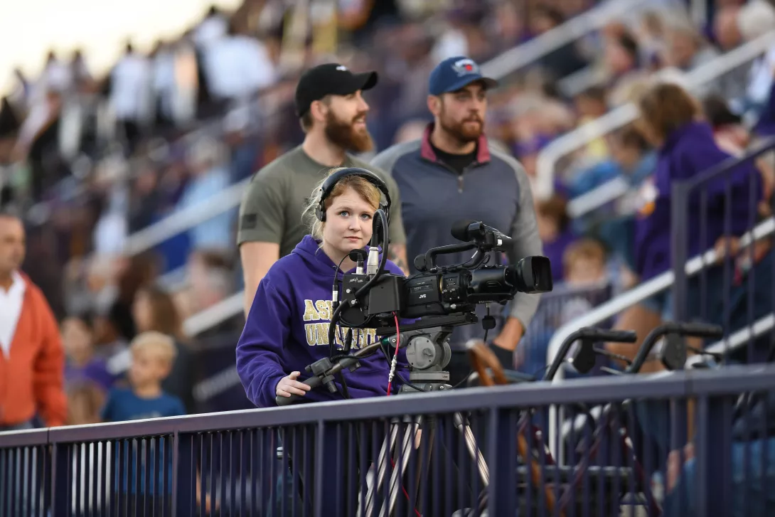 student operating camera