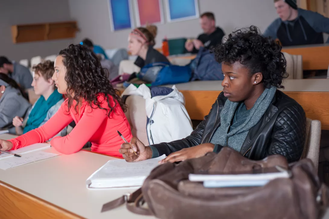 Students in Philosophy class taking notes