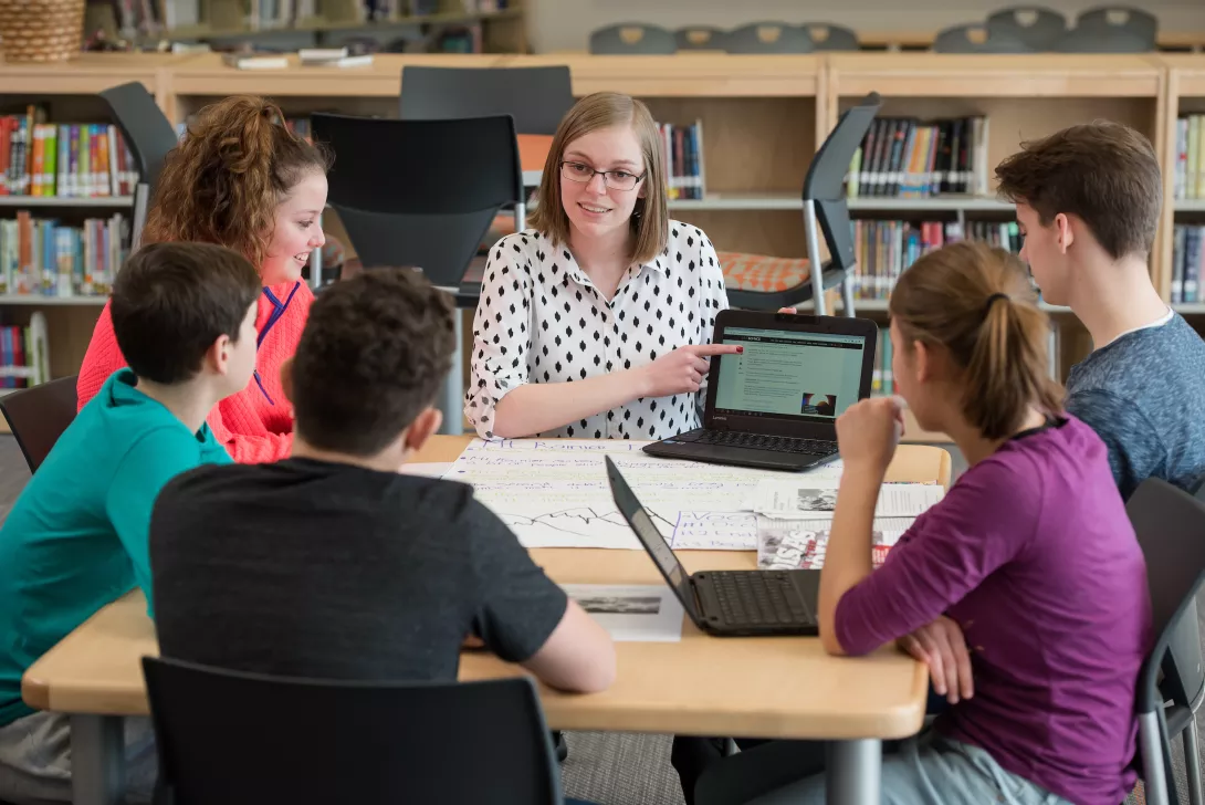 Student teacher working with students in classroom