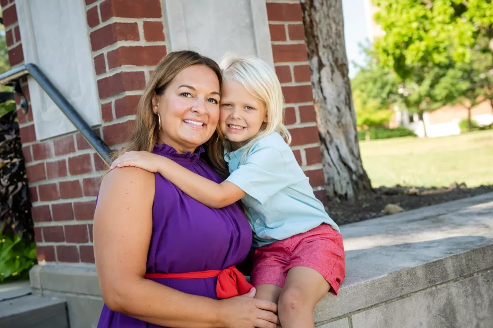 Jen McConnell '06 with her son Bodhi on the AU campus in 2022