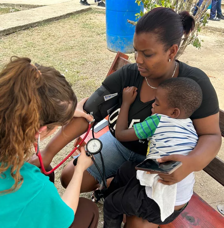 Checking a patient's blood pressure