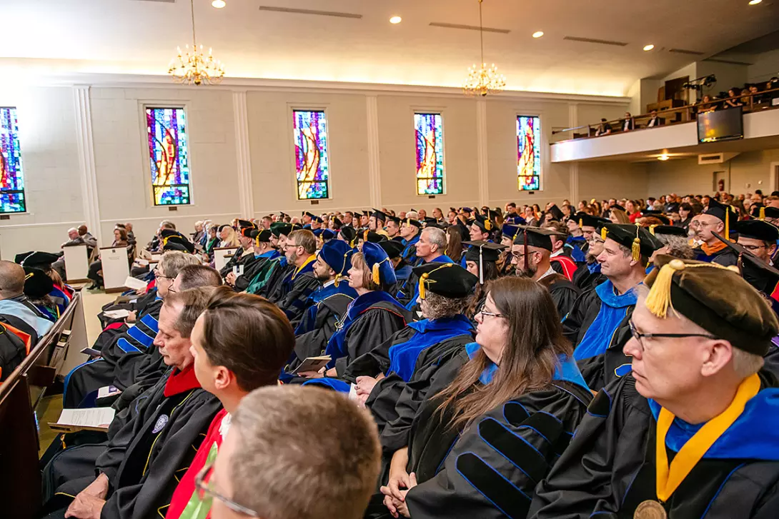 Crowd of faculty inside Miller Chapel during 2024 presidential inauguration