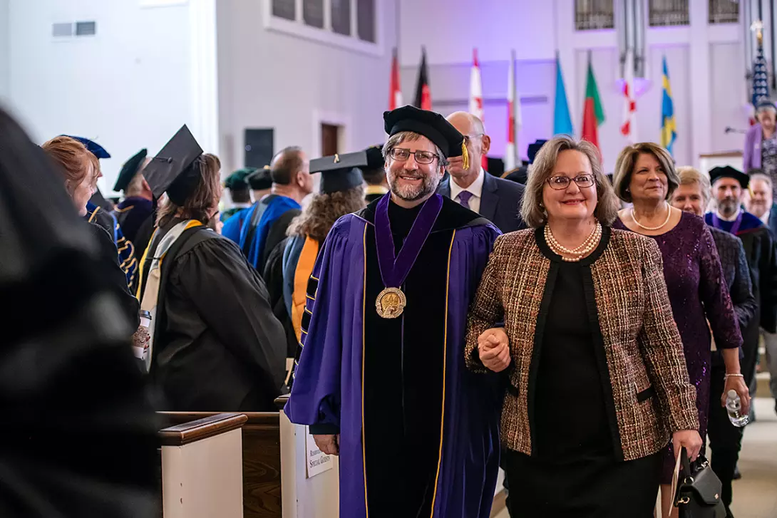 President Jon Parrish Peede and his wife, Rev. Nancy Holloman-Peede, exit inauguration 