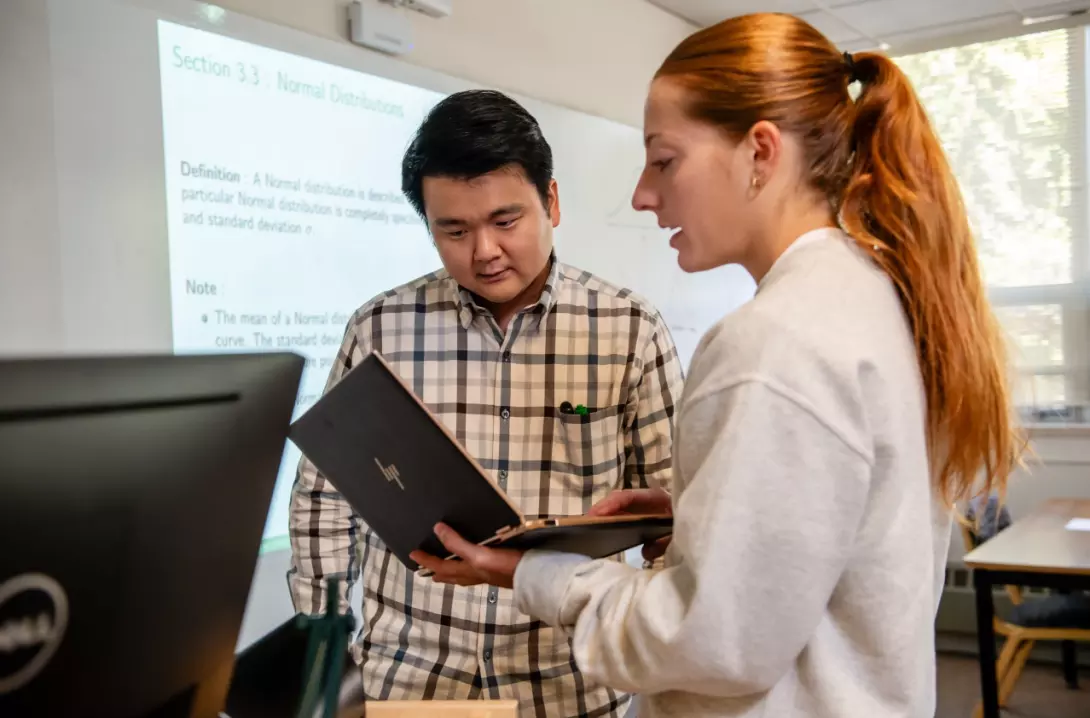 Yong Ju Lee, Ph.D, helps a student