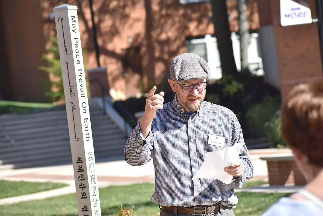 Peter Slade speaking at Peace Pole dedication